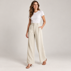 Women's casual high waisted wide-leg dress pants on a model, angled front view