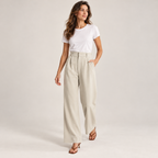 Women's casual high waisted wide-leg dress pants on a model, walking pose