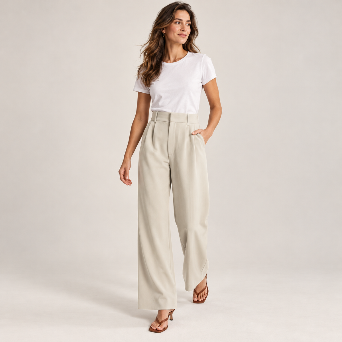 Women's casual high waisted wide-leg dress pants on a model, walking pose
