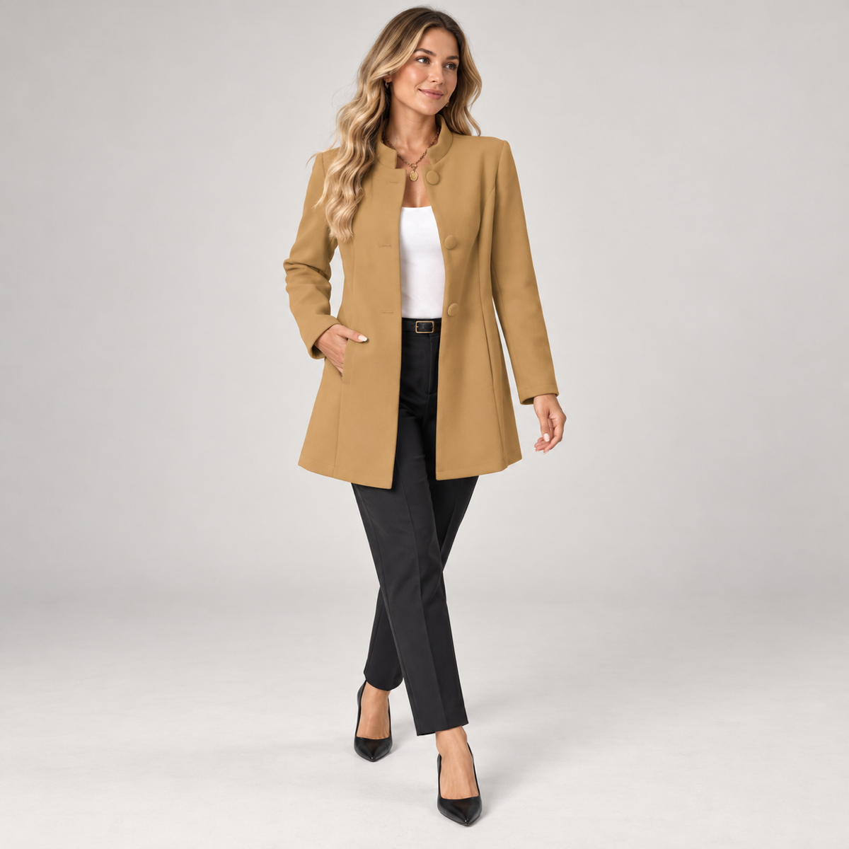 Women's collarless longline blazer with open front on a model, walking pose