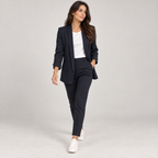 Women's fitted structured blazer on a model, walking pose