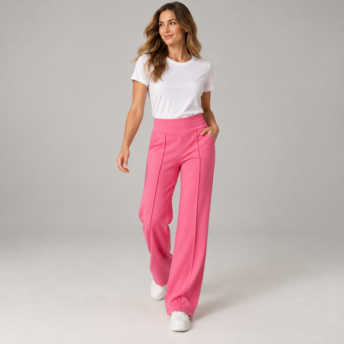 Women's high waisted wide-leg pants on a model, walking pose