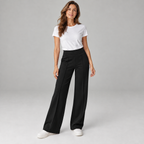 Women's high waisted wide-leg pants on a model in Black, additional studio view