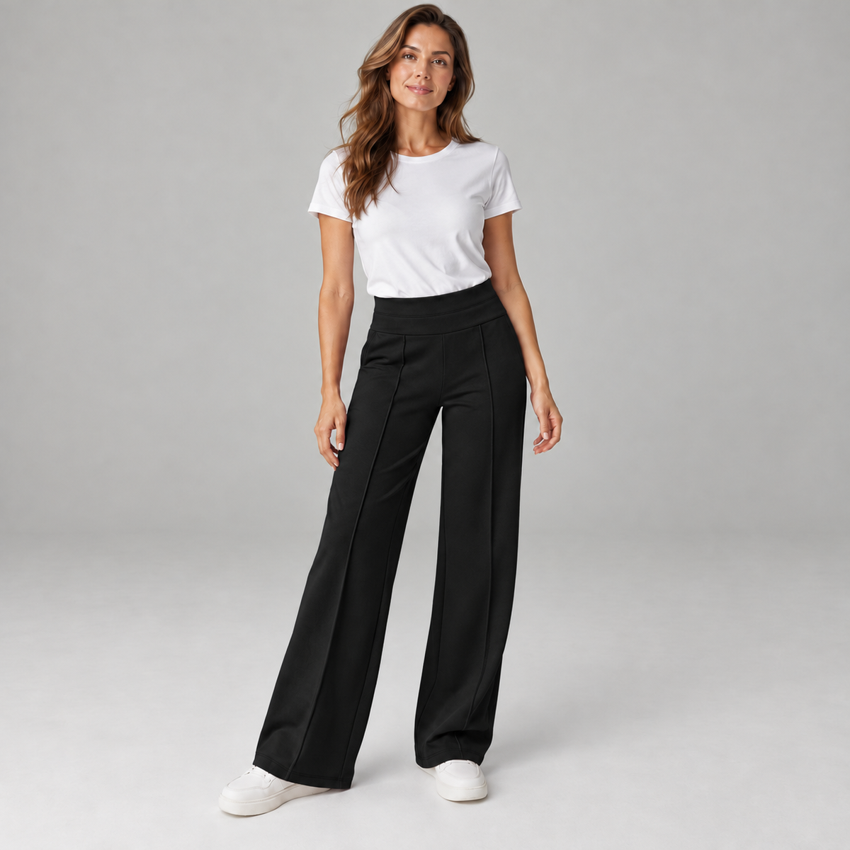 Women's high waisted wide-leg pants on a model in Black, additional studio view