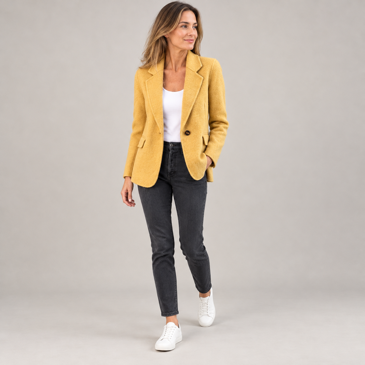 Women's lightweight breathable blazer on a model, angled front view