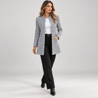 Women's longline open front blazer with stand collar on a model, walking pose