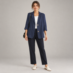 Women's relaxed fit two button blazer with roll-up sleeves on a model, front view