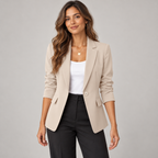 Women's single button blazer with narrow lapels and ruched sleeves on a model, closer front view