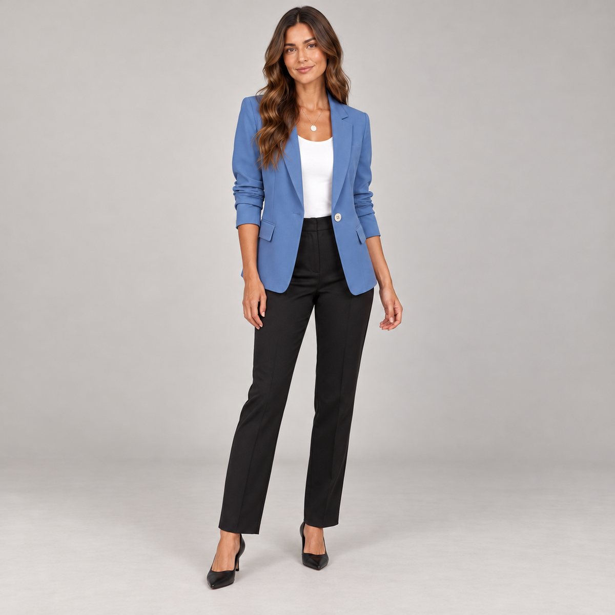 Women's single button blazer with narrow lapels and ruched sleeves on a model in Blue, additional studio view