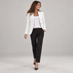 Women's single button blazer with padded shoulders and flap pockets on a model, walking pose