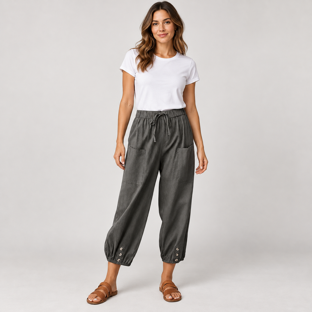 Women's tapered drawstring pants with deep pockets on a model, front view
