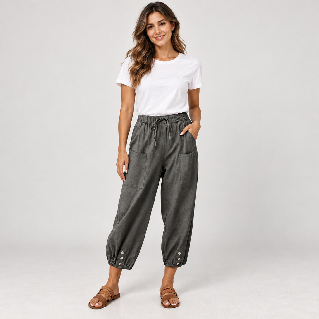 Women's tapered drawstring pants with deep pockets on a model, closer front view